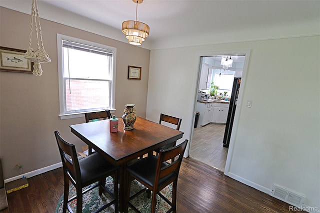 24271 Westhampton St, Oak Park, MI 48237 - dining area with baseboards and dark wood-style floors