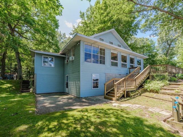 44850 Woodman Dr, Paw Paw, MI 49079 - rear view of house featuring stairway, a yard, and a wooden deck