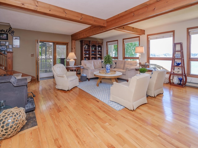 44850 Woodman Dr, Paw Paw, MI 49079 - living room with wood-type flooring, beam ceiling, plenty of natural light, and stairway