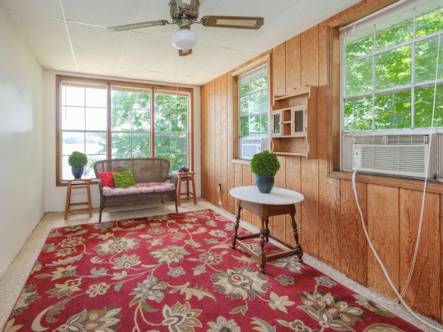 44850 Woodman Dr, Paw Paw, MI 49079 - sitting room featuring cooling unit, ceiling fan, carpet, and wood walls