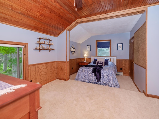 44850 Woodman Dr, Paw Paw, MI 49079 - bedroom with multiple windows, a wainscoted wall, wooden walls, lofted ceiling, and carpet flooring