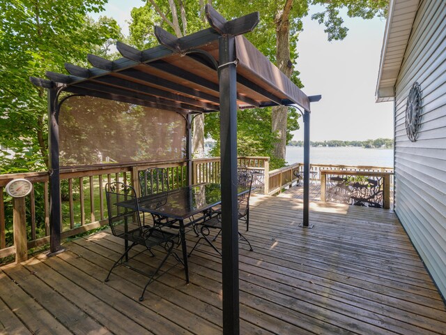 44850 Woodman Dr, Paw Paw, MI 49079 - wooden deck featuring a water view and outdoor dining area