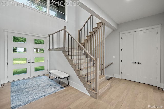 1760 Hamilton Dr, Bloomfield Hills, MI 48302 - foyer featuring french doors, stairway, wood finished floors, and a high ceiling