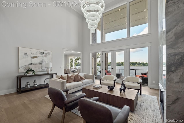 1760 Hamilton Dr, Bloomfield Hills, MI 48302 - living room with a towering ceiling, french doors, wood finished floors, and a water view