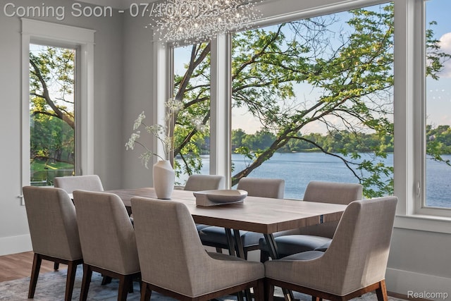 1760 Hamilton Dr, Bloomfield Hills, MI 48302 - dining area featuring a chandelier, a water view, and wood finished floors