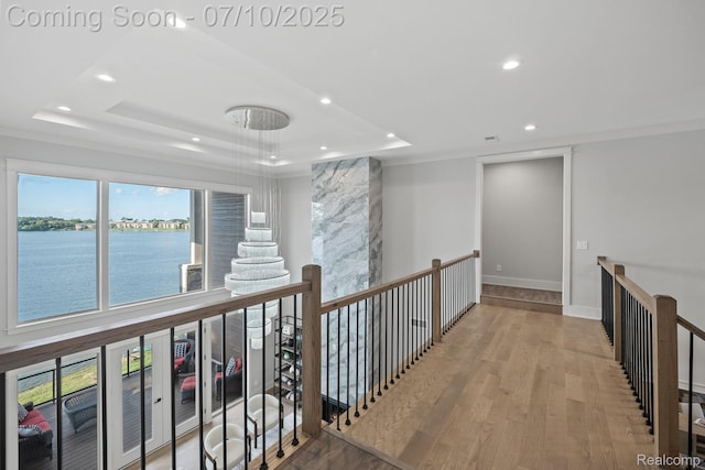 1760 Hamilton Dr, Bloomfield Hills, MI 48302 - corridor featuring an upstairs landing, a tray ceiling, recessed lighting, wood finished floors, and a water view