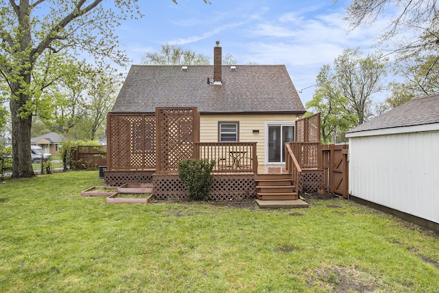 46 N 31st St, Battle Creek, MI 49015 - rear view of property with a chimney, a deck, and roof with shingles