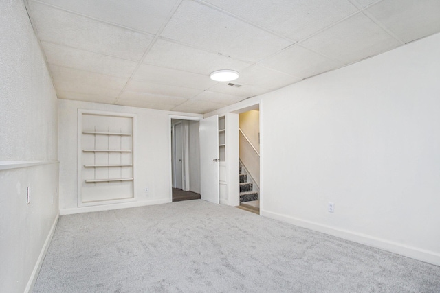 46 N 31st St, Battle Creek, MI 49015 - finished below grade area with carpet floors, built in features, a drop ceiling, and stairway