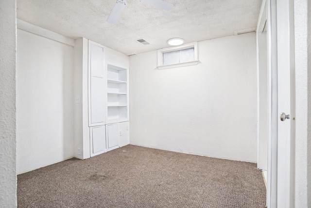 46 N 31st St, Battle Creek, MI 49015 - unfurnished bedroom with carpet flooring, a textured ceiling, and a ceiling fan