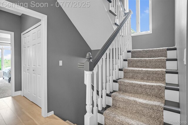 2545 Hartun Dr, Brighton, MI 48114 - stairs with wood finished floors and baseboards