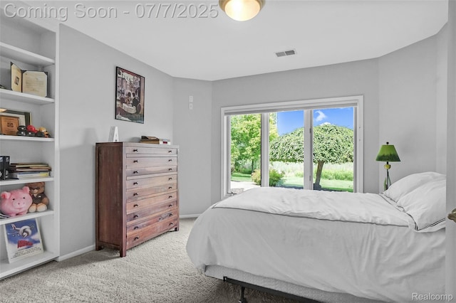 2545 Hartun Dr, Brighton, MI 48114 - carpeted bedroom featuring baseboards and access to exterior