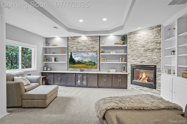 2545 Hartun Dr, Brighton, MI 48114 - living area with a large fireplace, carpet, built in shelves, a raised ceiling, and recessed lighting