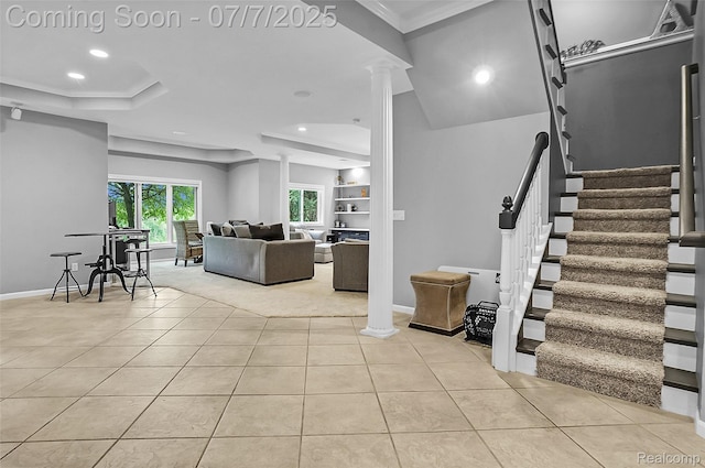 2545 Hartun Dr, Brighton, MI 48114 - living area with light tile patterned floors, ornate columns, recessed lighting, stairway, and ornamental molding