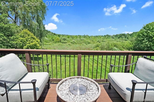 2545 Hartun Dr, Brighton, MI 48114 - wooden deck featuring a yard and a wooded view
