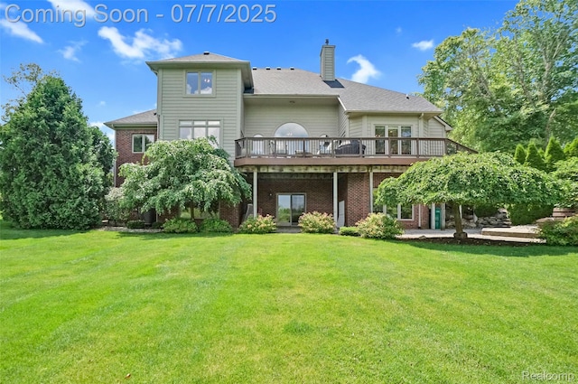 2545 Hartun Dr, Brighton, MI 48114 - rear view of property with a wooden deck, a chimney, a lawn, and brick siding