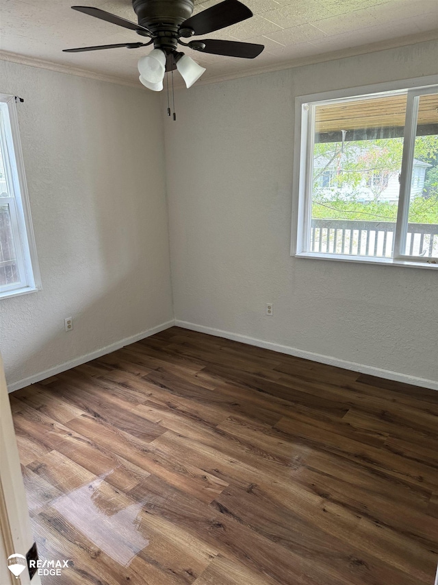 11454 Haven St, Clio, MI 48420 - spare room featuring crown molding, wood finished floors, a ceiling fan, and a textured wall
