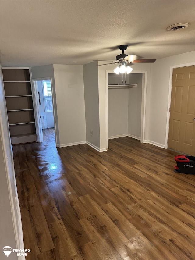 11454 Haven St, Clio, MI 48420 - unfurnished room featuring dark wood-type flooring, ceiling fan, and a textured ceiling