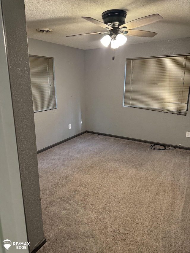 11454 Haven St, Clio, MI 48420 - spare room featuring carpet, a ceiling fan, and a textured ceiling