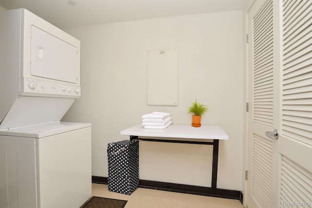 1135 Shelby St Unit 2607, Detroit, MI 48226 - washroom with stacked washing machine and dryer and light tile patterned floors