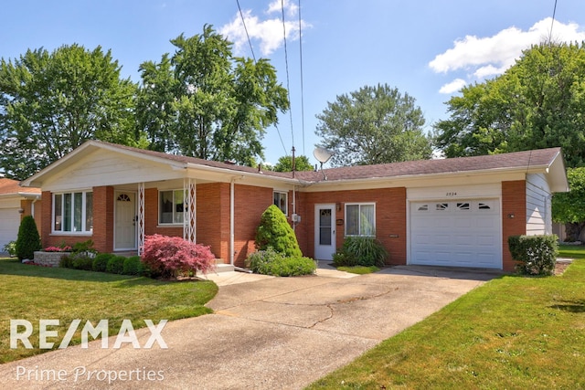 2524 Whitemore Pl, Saginaw, MI 48602 - single story home featuring an attached garage, brick siding, concrete driveway, and a front lawn
