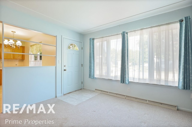 2524 Whitemore Pl, Saginaw, MI 48602 - carpeted entrance foyer featuring baseboard heating and a chandelier
