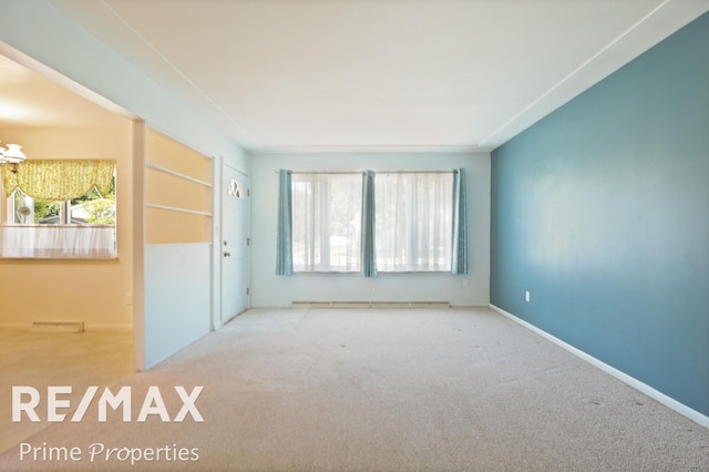 2524 Whitemore Pl, Saginaw, MI 48602 - carpeted spare room featuring baseboard heating and baseboards