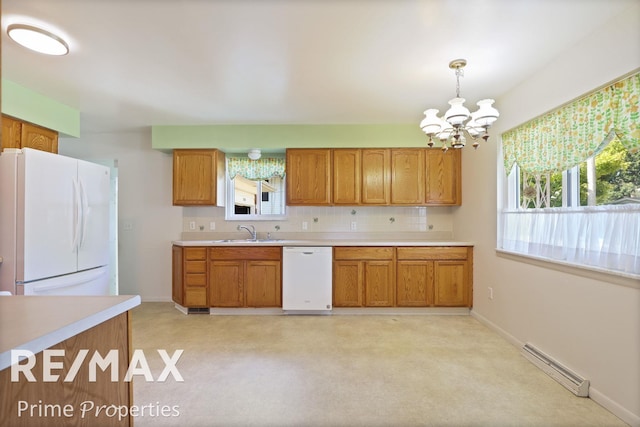 2524 Whitemore Pl, Saginaw, MI 48602 - kitchen with white appliances, a chandelier, light countertops, and brown cabinets