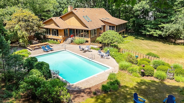 295 N Lakeshore Dr, Holland, MI 49424 - outdoor pool with a sunroom, a patio area, and a deck