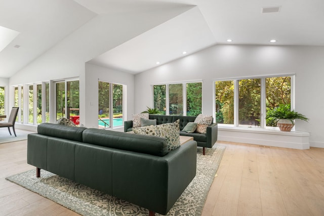 295 N Lakeshore Dr, Holland, MI 49424 - living area with high vaulted ceiling, recessed lighting, and light wood finished floors