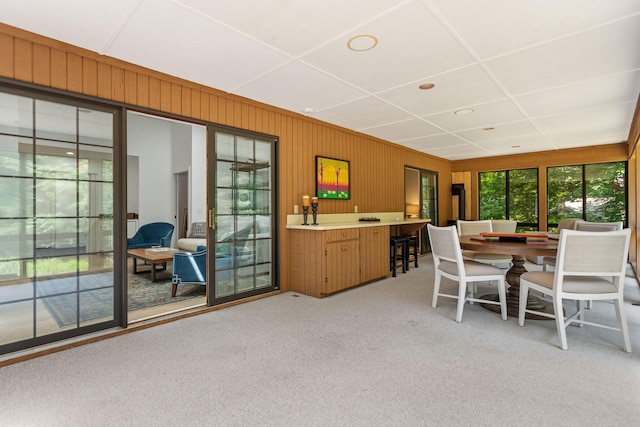 295 N Lakeshore Dr, Holland, MI 49424 - dining room with light carpet and wooden walls