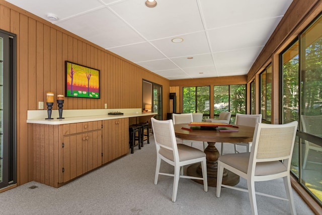 295 N Lakeshore Dr, Holland, MI 49424 - dining room with light carpet and wood walls