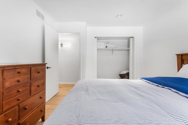 295 N Lakeshore Dr, Holland, MI 49424 - bedroom with light wood-type flooring and a closet