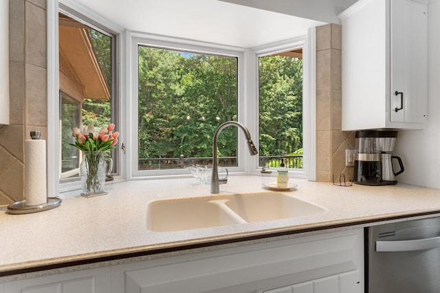 295 N Lakeshore Dr, Holland, MI 49424 - kitchen with dishwasher, white cabinets, and tasteful backsplash