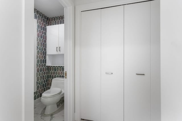 295 N Lakeshore Dr, Holland, MI 49424 - bathroom with tile walls and marble look tile flooring