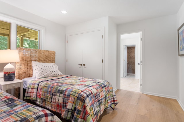295 N Lakeshore Dr, Holland, MI 49424 - bedroom featuring light wood-type flooring, recessed lighting, and a closet