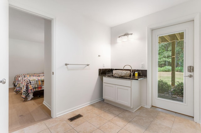 295 N Lakeshore Dr, Holland, MI 49424 - bathroom featuring vanity and tile patterned floors