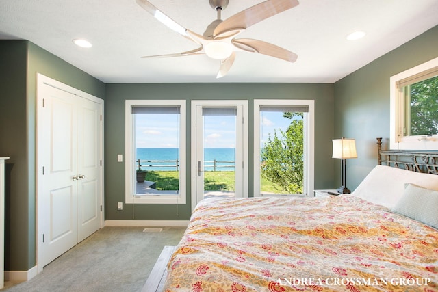 1228 Shore Crest Dr, South Haven, MI 49090 - bedroom featuring a water view, light carpet, access to outside, recessed lighting, and ceiling fan