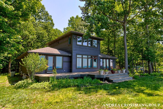 1228 Shore Crest Dr, South Haven, MI 49090 - rear view of property featuring a wooden deck and a yard