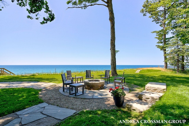 1228 Shore Crest Dr, South Haven, MI 49090 - view of patio / terrace with a fire pit and a water view