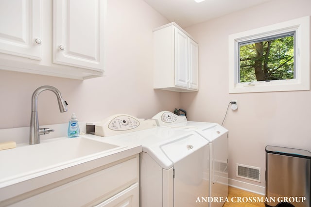 1228 Shore Crest Dr, South Haven, MI 49090 - laundry area featuring cabinet space and washing machine and clothes dryer
