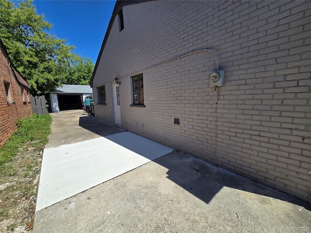 15335 Mccann St, Southgate, MI 48195 - view of property exterior with brick siding, an outbuilding, and a garage