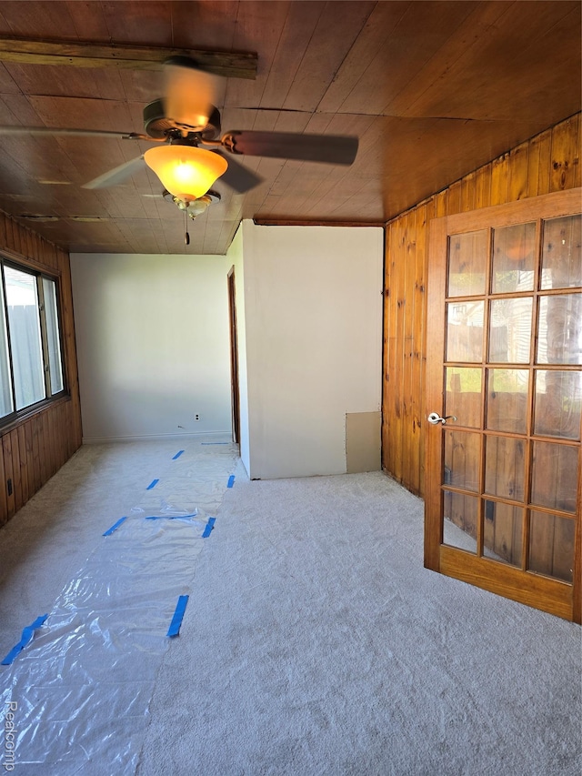 15335 Mccann St, Southgate, MI 48195 - carpeted spare room with ceiling fan, wooden walls, and wooden ceiling