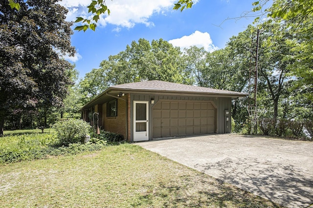 55835 Davis Ln, Dowagiac, MI 49047 - view of side of home with an attached garage, brick siding, and roof with shingles