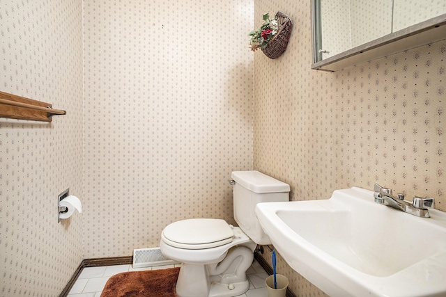 55835 Davis Ln, Dowagiac, MI 49047 - half bathroom featuring wallpapered walls and tile patterned floors
