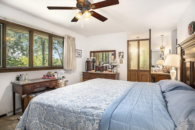 55835 Davis Ln, Dowagiac, MI 49047 - bedroom featuring carpet, a baseboard heating unit, and ceiling fan