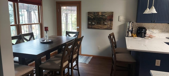 15203 Woodpine Dr, Monroe, MI 48161 - dining room with dark wood finished floors and baseboards