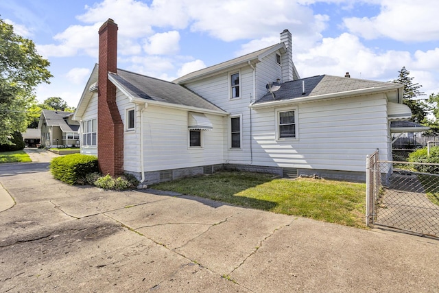 715 Ellery Ave, Jackson, MI 49202 - rear view of property with a chimney