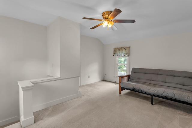 715 Ellery Ave, Jackson, MI 49202 - living area featuring vaulted ceiling, carpet, ceiling fan, and an upstairs landing