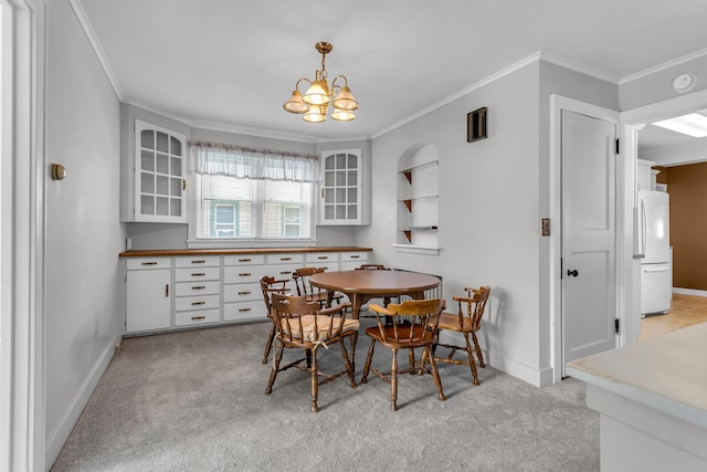 715 Ellery Ave, Jackson, MI 49202 - dining space featuring crown molding, light colored carpet, and a chandelier