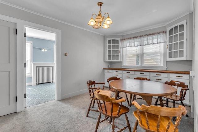 715 Ellery Ave, Jackson, MI 49202 - dining room with radiator, light colored carpet, ornamental molding, and a chandelier